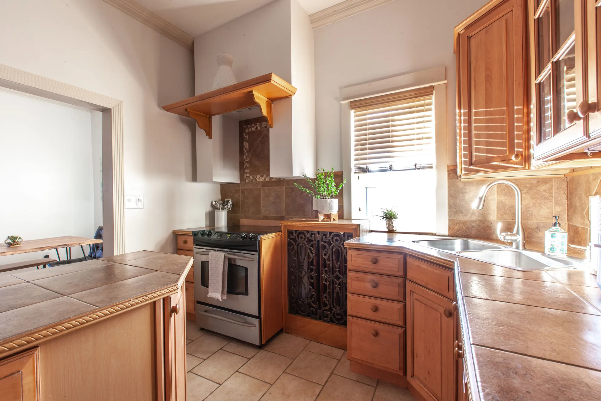 Loft B full kitchen with stainless steel appliances and dining area