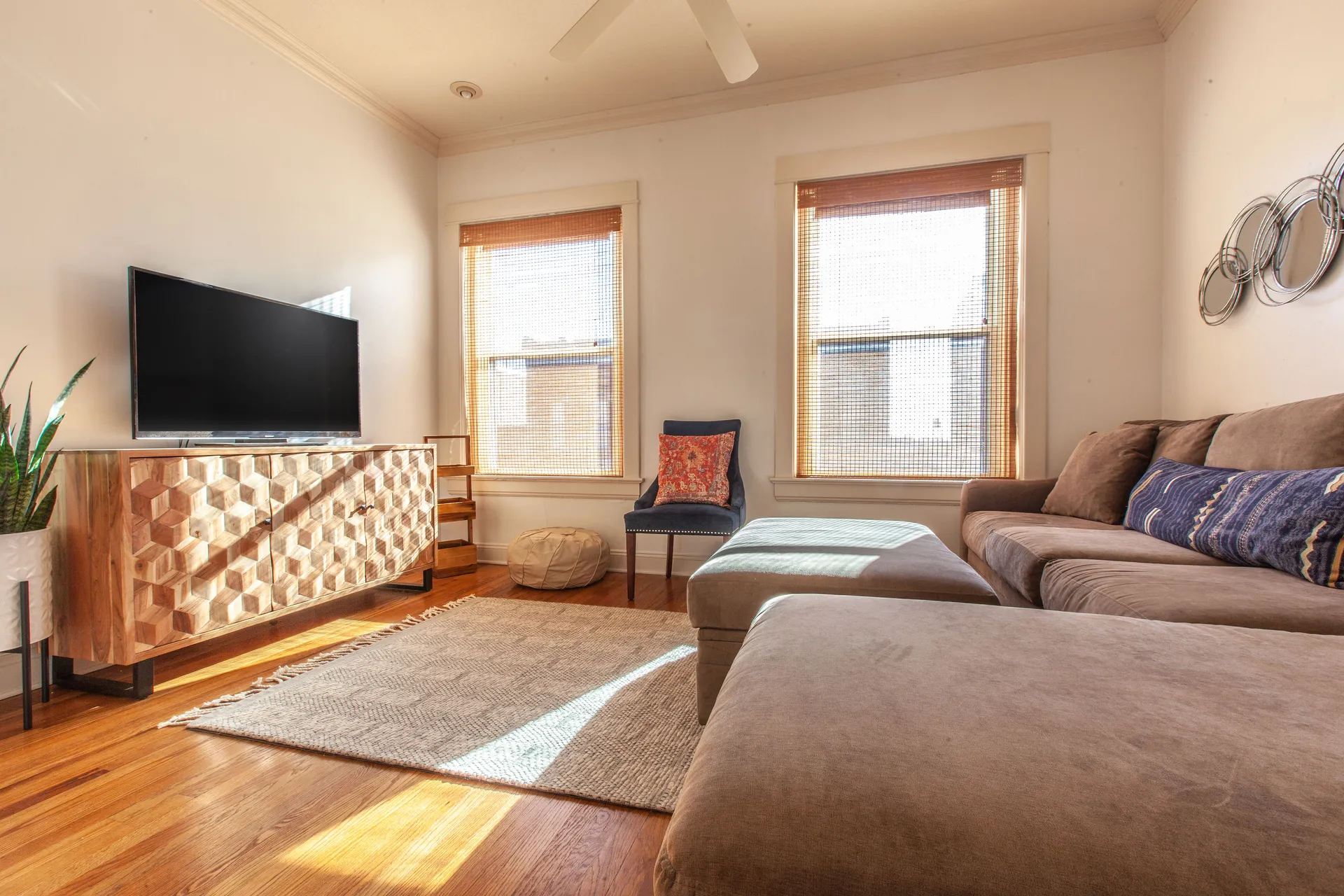 Loft A living room with oversized windows and natural light at Three Trails Lofts
